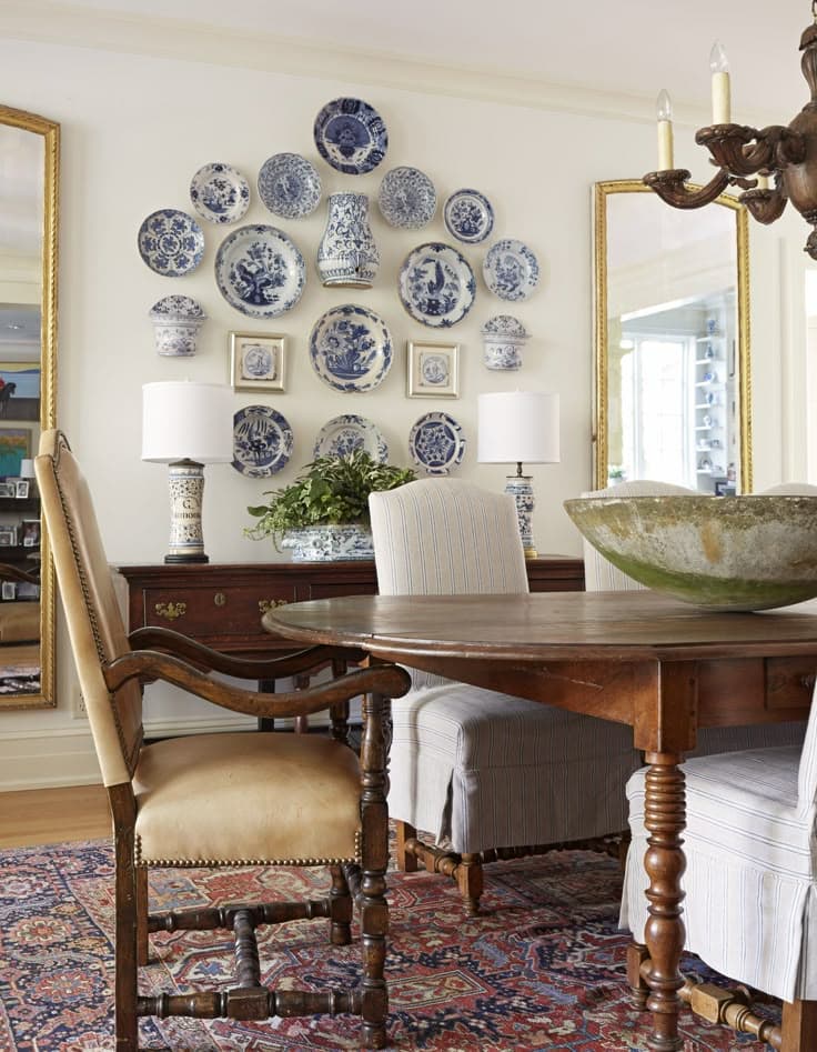 Dining room with mirrors and decorative plates